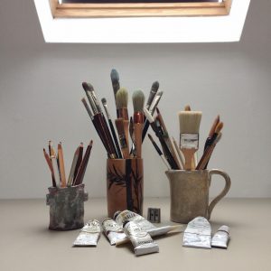 paintbrushes in an artist studio